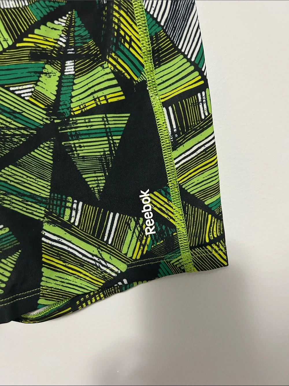 Reebok Men’s Black and Green Geometric Athletic Shorts
